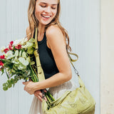 Women's bowling bag in green die-cut leather