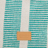 Small raffia basket with white and turquoise striped print