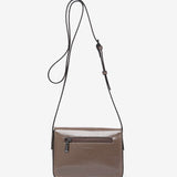 Small patent leather crossbody bag in taupe