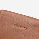 Piccola borsa da toilette in pelle color cognac