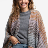 Poncho con estampado a rayas y flecos azul