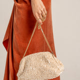 Sequin clutch bag in beige.