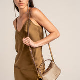 Gold-colored handbag.