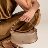 Gold-colored handbag.