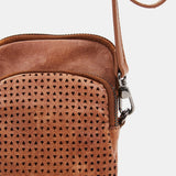 Mobile phone bag in cognac die-cut leather