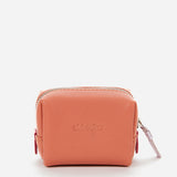 Small women's leather toiletry bag with orange die-cut logo
