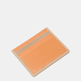 Tarjetero en piel naranja