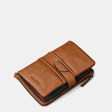 Mittlere Damenbrieftasche aus cognacfarbenem Leder.