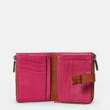 Piccola borsa da donna in pelle fucsia.