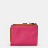 Piccola borsa da donna in pelle fucsia.