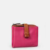 Piccola borsa da donna in pelle fucsia.