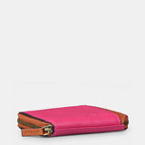 Porta carte da donna in pelle fucsia.