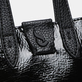 Bolso de mano de charol en negro