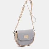 Bandolera pequeña en materiales reciclados en azul