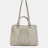 Bolso de mano troquelado en materiales reciclados verde