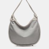 Bolso - mochila en materiales reciclados plata