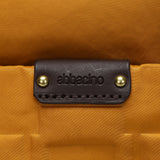 Bolso multifuncional en nylon reciclado ámbar