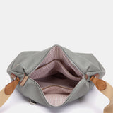 Graue Umhängetasche