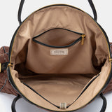 Gesteppte Handtasche in Braun.