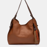 Bolso de hombro con borla cognac