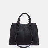 Schwarze Handtasche.