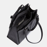 Schwarze Handtasche.