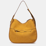 Shoulder bag made from recycled materials in amber.