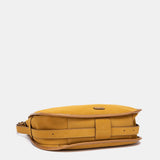 Shoulder bag made from recycled materials in amber.