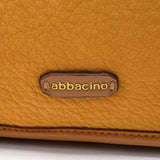 Shoulder bag made from recycled materials in amber.