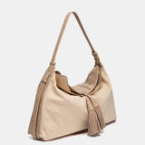 Bolso de hombro con borla beige