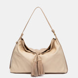 Bolso de hombro con borla beige