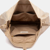 Bolso de hombro con borla beige