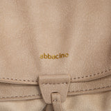 Bolso de hombro con borla beige