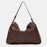Bolso de hombro con borla marrón