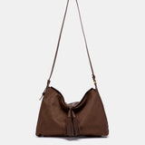 Bolso de hombro con borla marrón