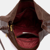 Bolso de hombro con borla marrón