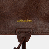 Bolso de hombro con borla marrón