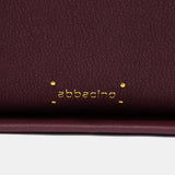 Bolso de hombro en materiales reciclados burdeos