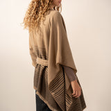 Brown poncho with a bow.