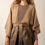Brown poncho with a bow.