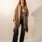 Brown poncho with a bow.