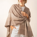 Beige plaid adjustable poncho.