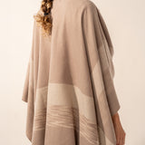 Beige plaid adjustable poncho.