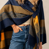 Adjustable blue plaid poncho.