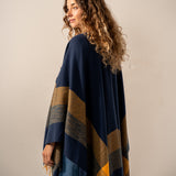 Adjustable blue plaid poncho.