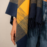 Adjustable blue plaid poncho.