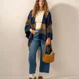 Adjustable blue plaid poncho.