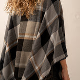 Reversible black poncho.
