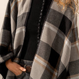 Reversible black poncho.