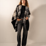 Reversible black poncho.